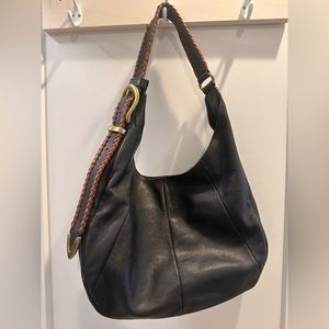 Frye black shoulder bag with brown leather accent on strap.